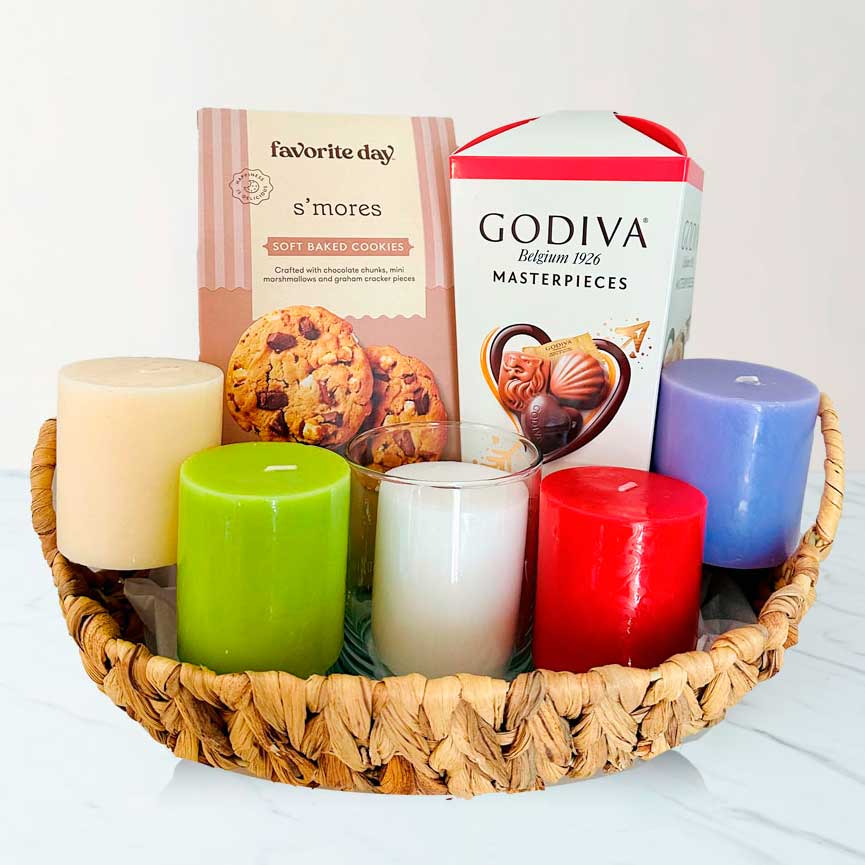 Sympathy gift basket with candles and comforting treats